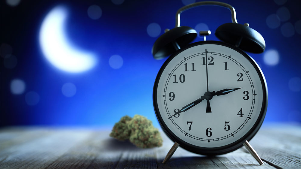 Alarm clock with cannabis nug and night sky in background