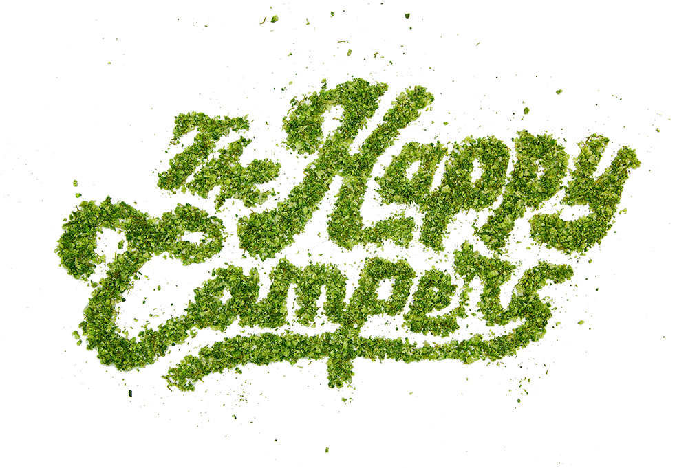 The Happy Campers cannabis logo made out of ground up weed.